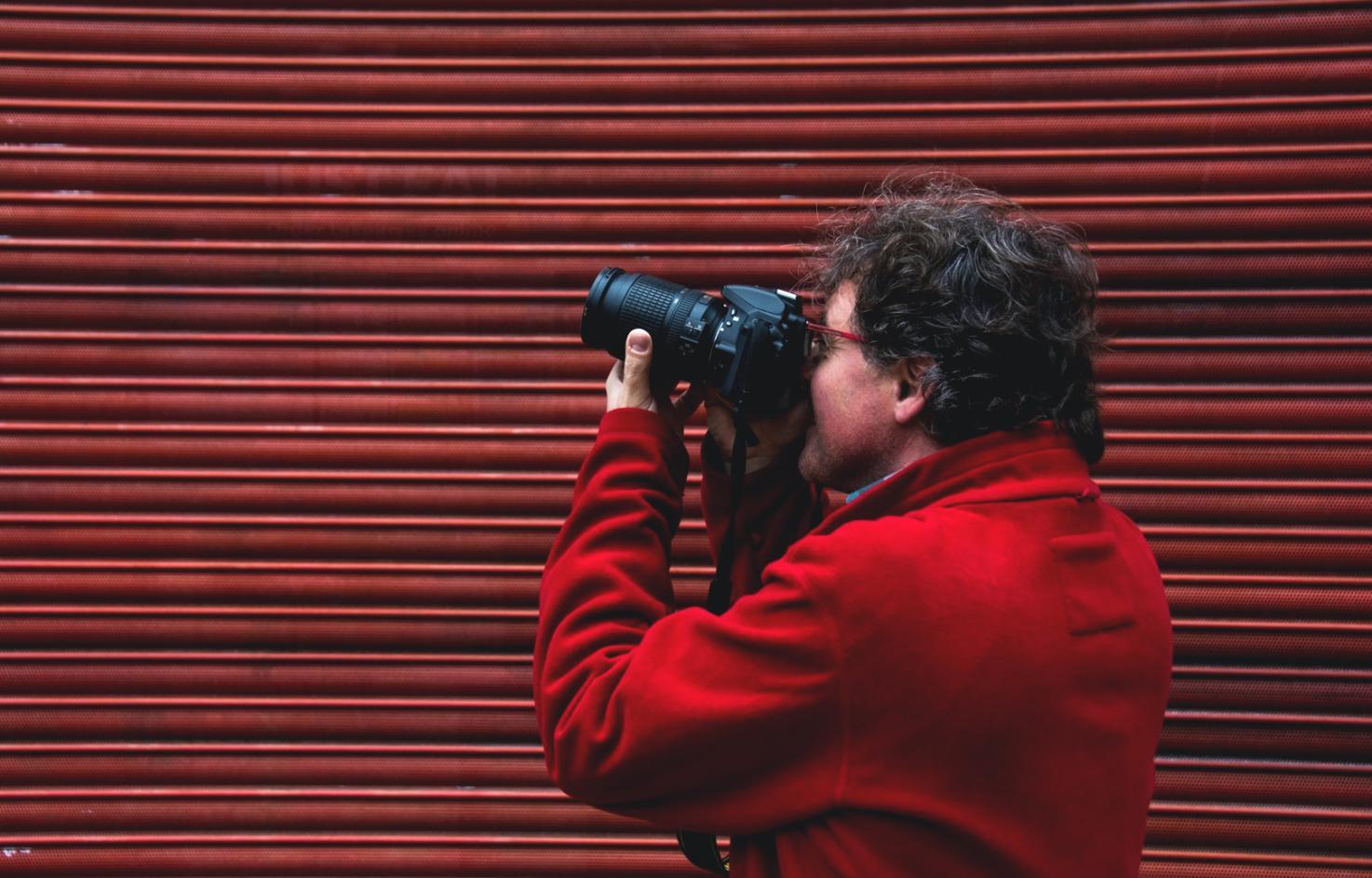 Professional film editing workspace with multiple monitors showing video editing software and color correction tools